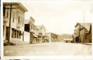 An old, empty downtown street flanked with buildings